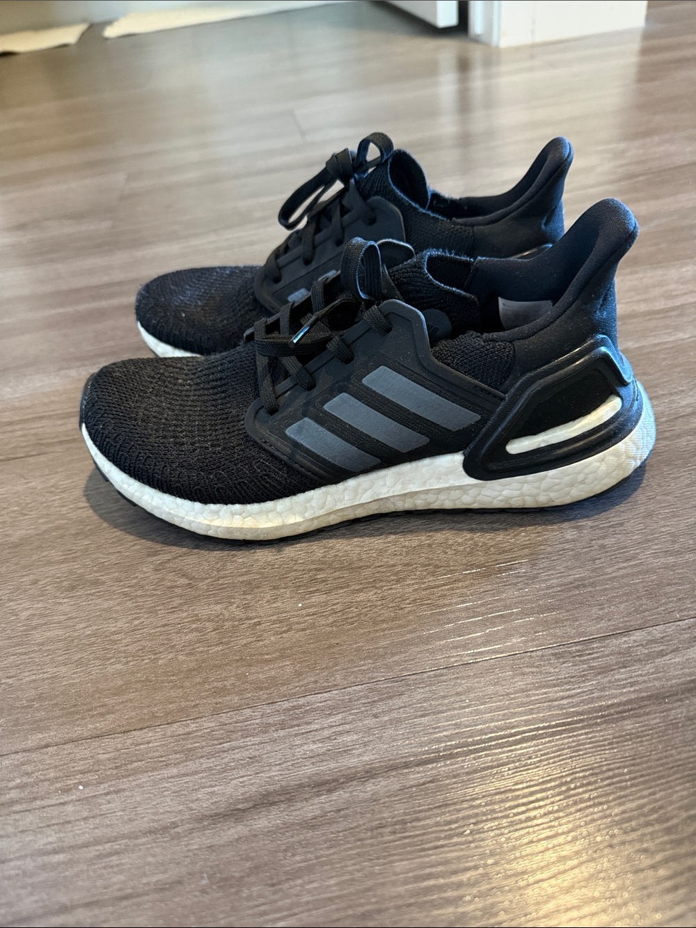 adidas Black and White Ultraboost tennis shoes